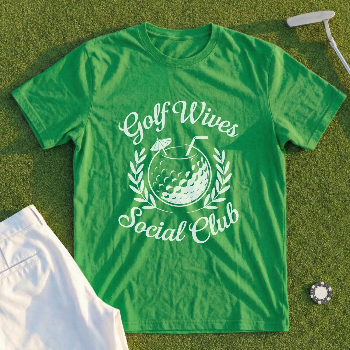 Green t-shirt with "Golf Wives Social Club" text and golf ball design.