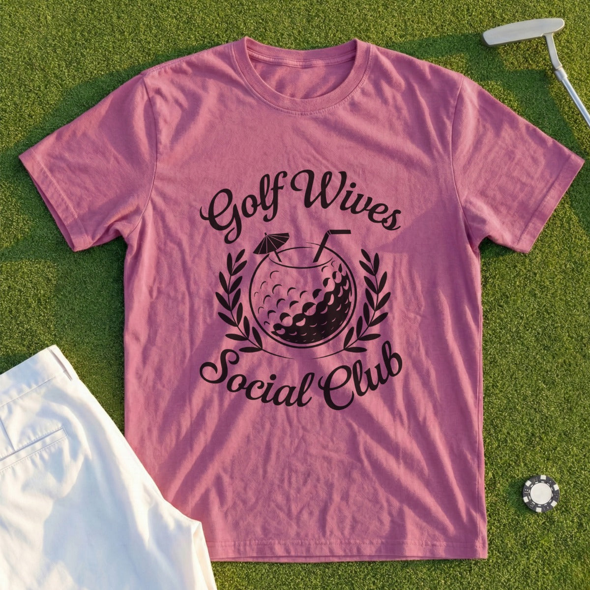 Pink t-shirt with "Golf Wives Social Club" text and a golf ball cocktail.