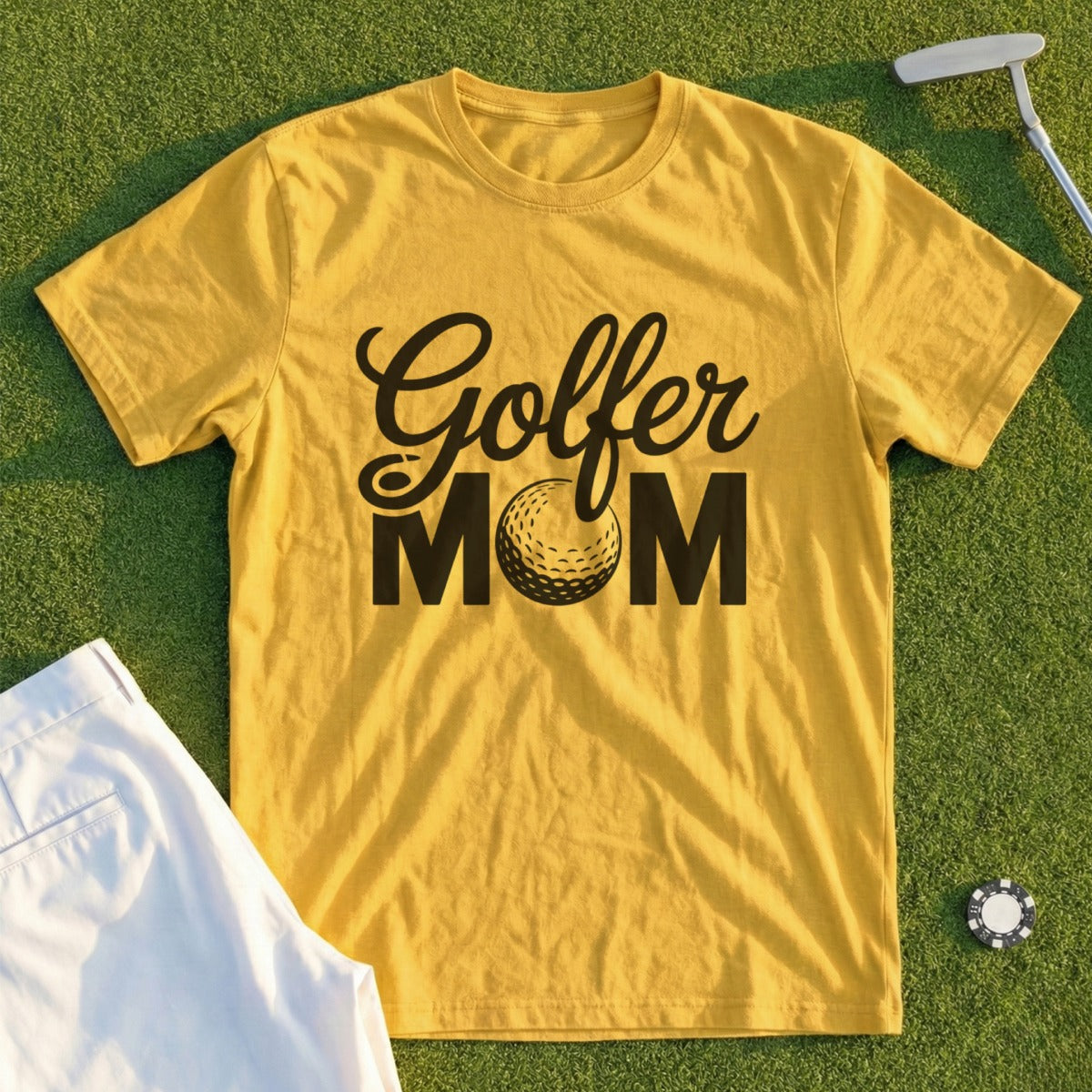 Yellow t-shirt with "Golfer Mom" text and a golf ball graphic.
