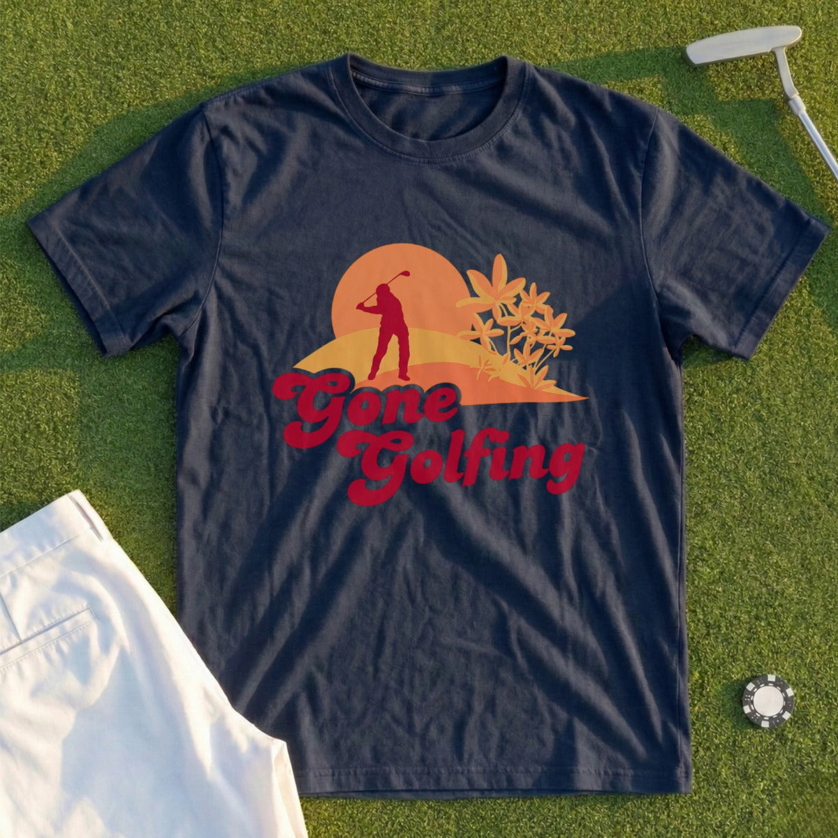 Navy t-shirt with "Gone Golfing" text and sunset golf scene graphic.