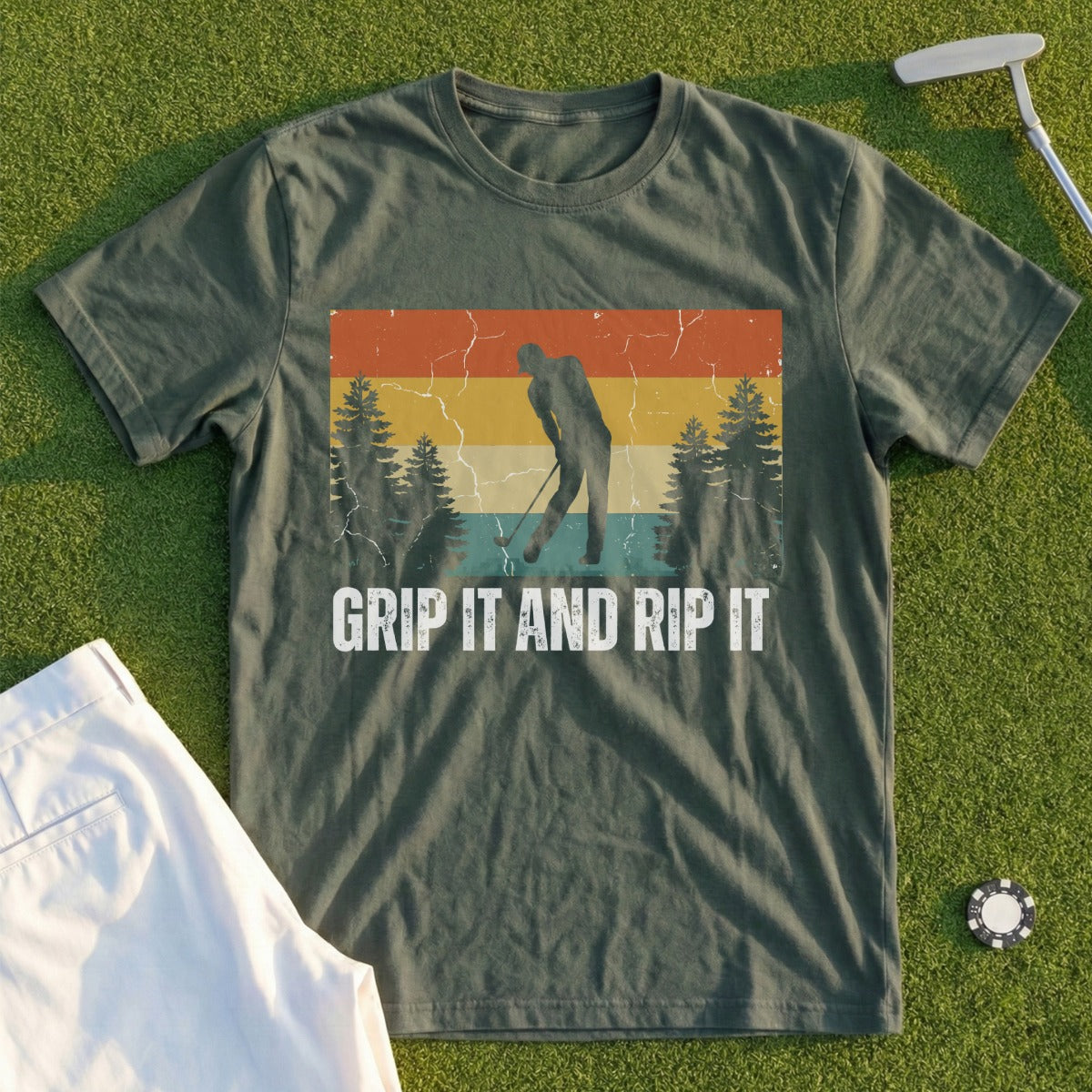 Green t-shirt with vintage sunset golf graphic and "Grip It and Rip It" text.