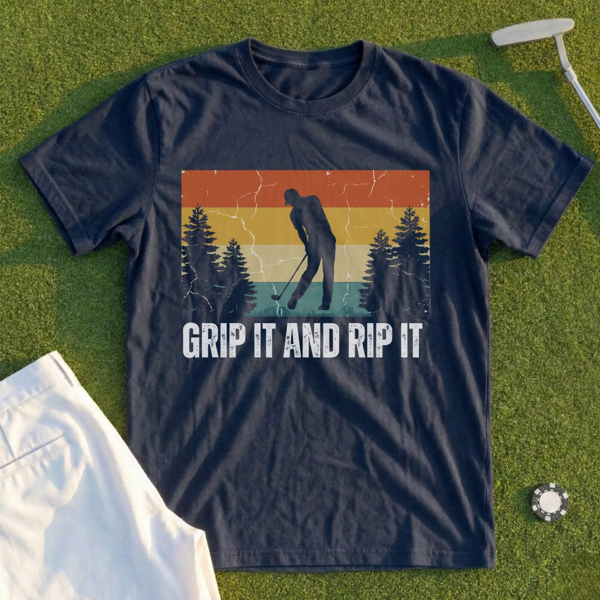 Dark blue t-shirt with "GRIP IT AND RIP IT" text and golfer graphic.