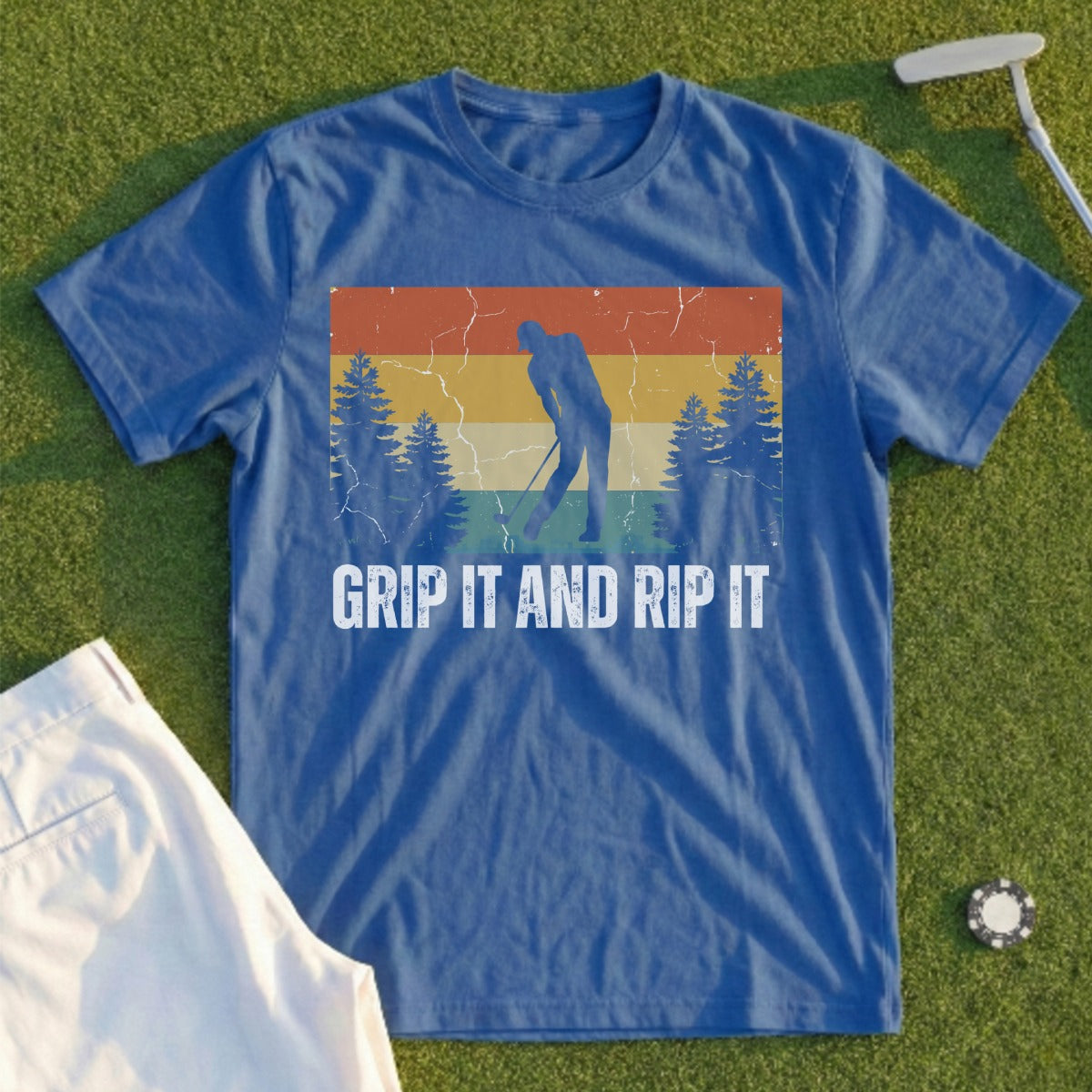 Blue t-shirt with vintage graphic of golfer, trees, and text "GRIP IT AND RIP IT".
