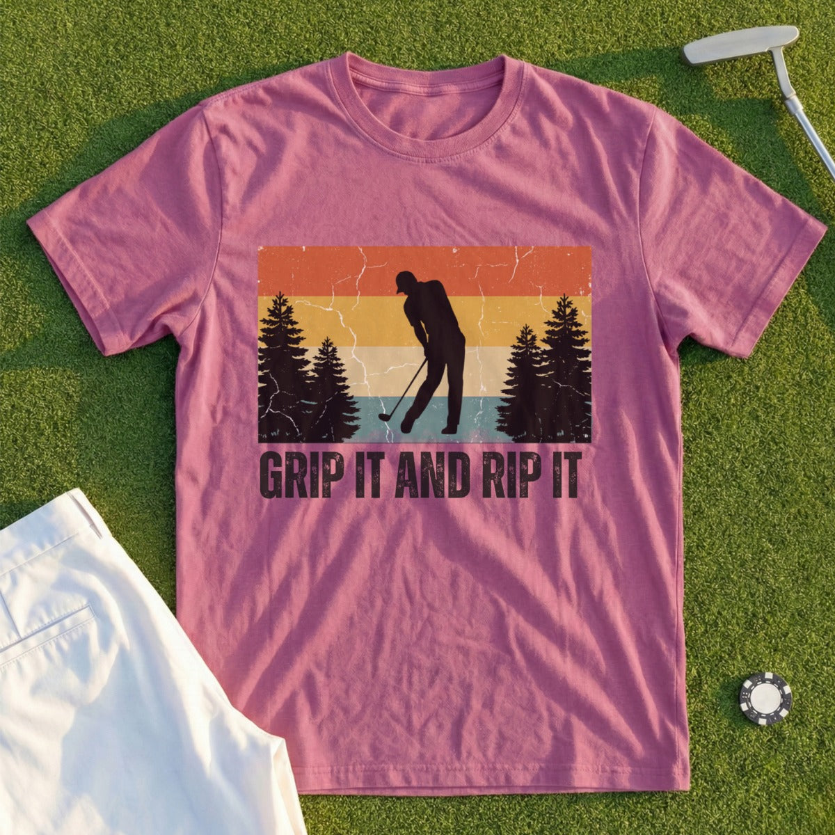 Mauve t-shirt with distressed graphic of a golfer, trees, and "Grip It and Rip It" text.