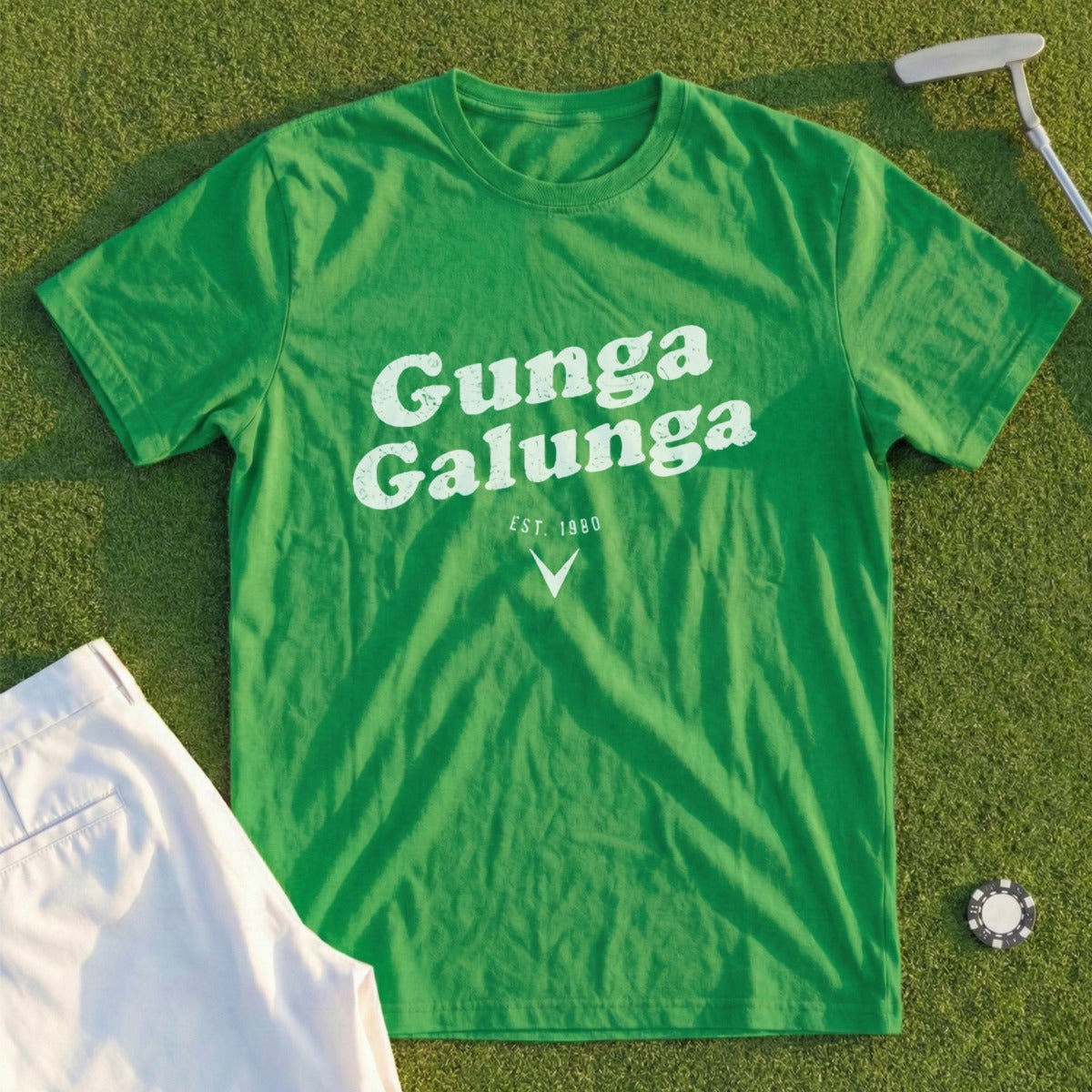 Green t-shirt with "Gunga Galunga EST. 1980" in white text on a golf course.
