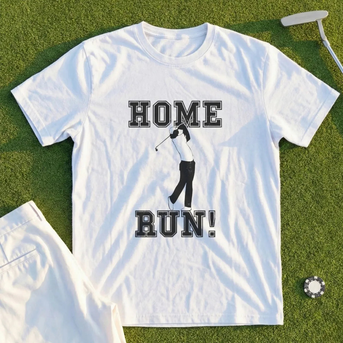 White t-shirt with "HOME RUN!" graphic of a golfer mid-swing.