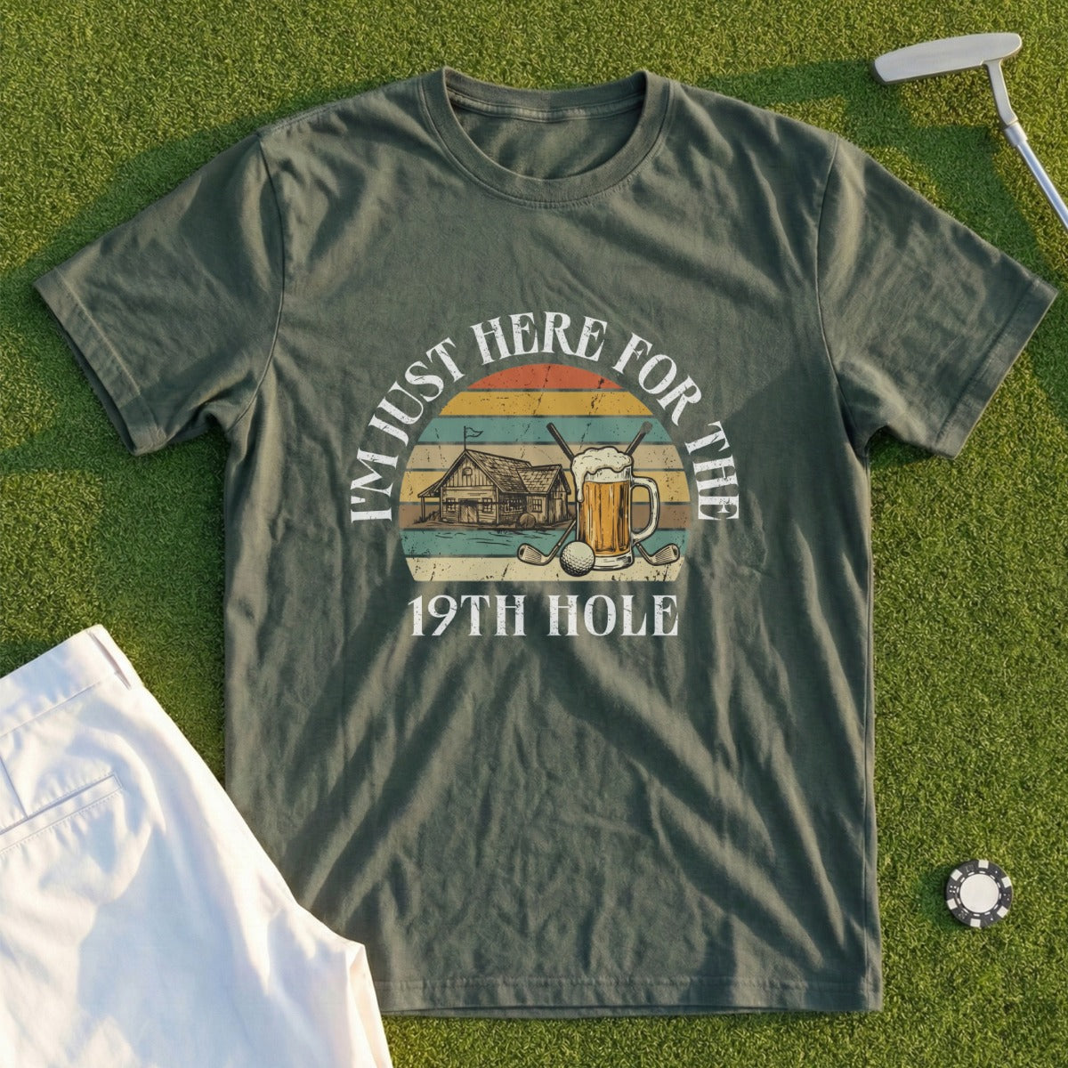 Green t-shirt with "I'm Just Here for the 19th Hole" text and golf/beer graphic.