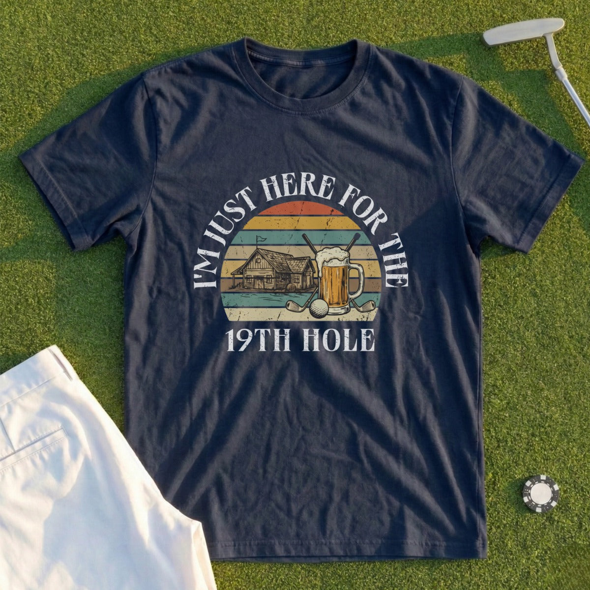 Navy t-shirt with "I'm just here for the 19th hole" text and golf/beer graphic.