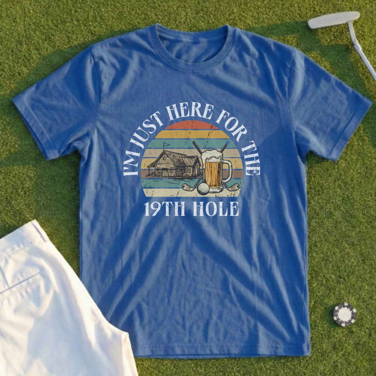 Blue t-shirt with "I'm just here for the 19th hole" and golf illustration.