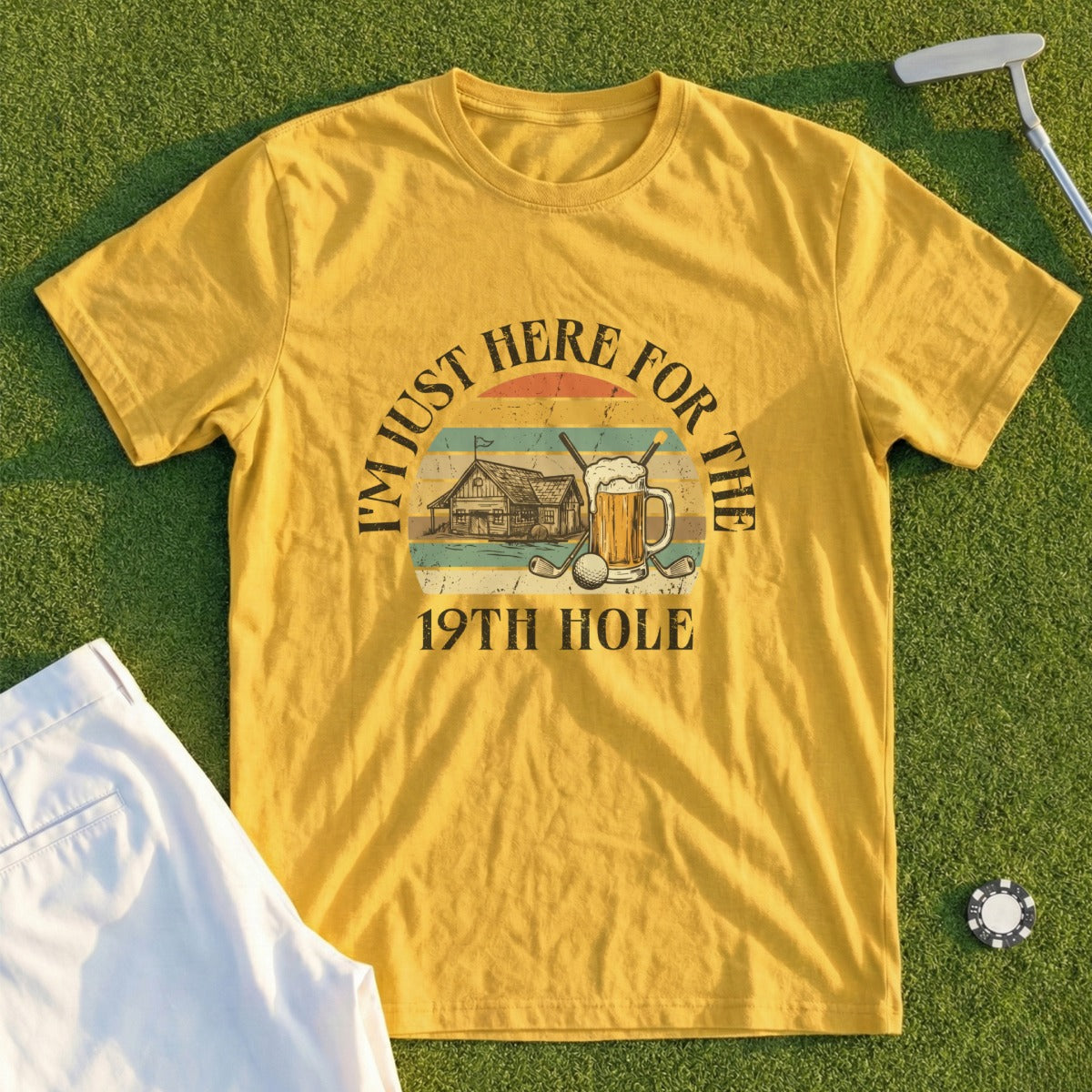 Yellow t-shirt with "I'm just here for the 19th hole" text and a golf scene.