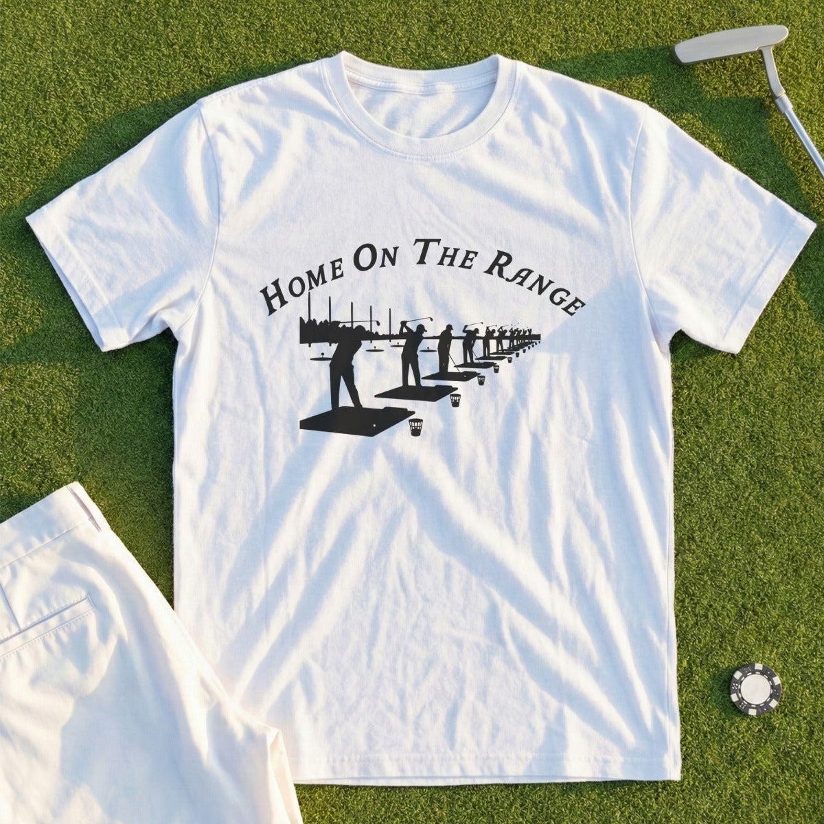 White t-shirt with "Home on the Range" text and golf driving range graphic.