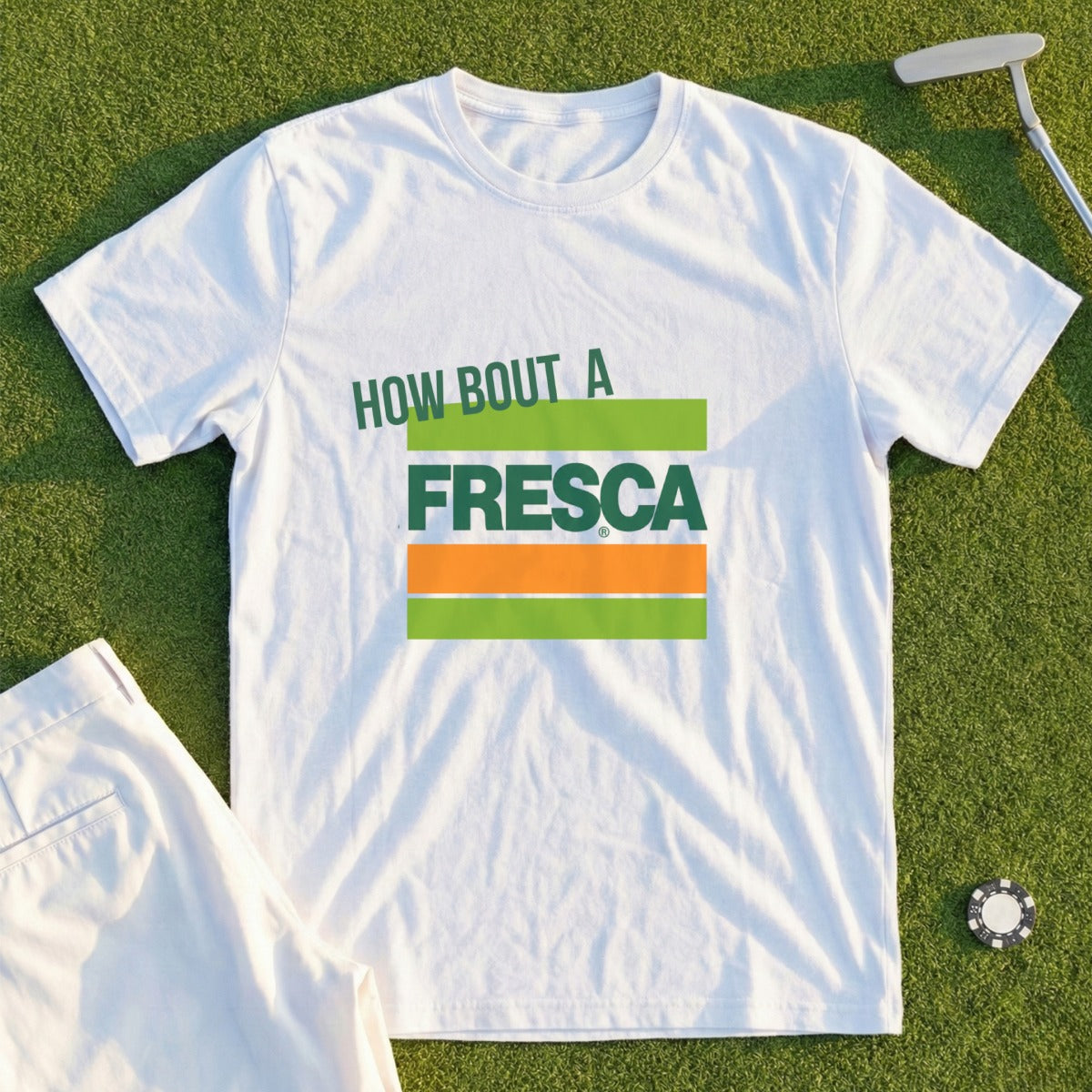White t-shirt with "How Bout A Fresca" and stacked green and orange Fresca logo.