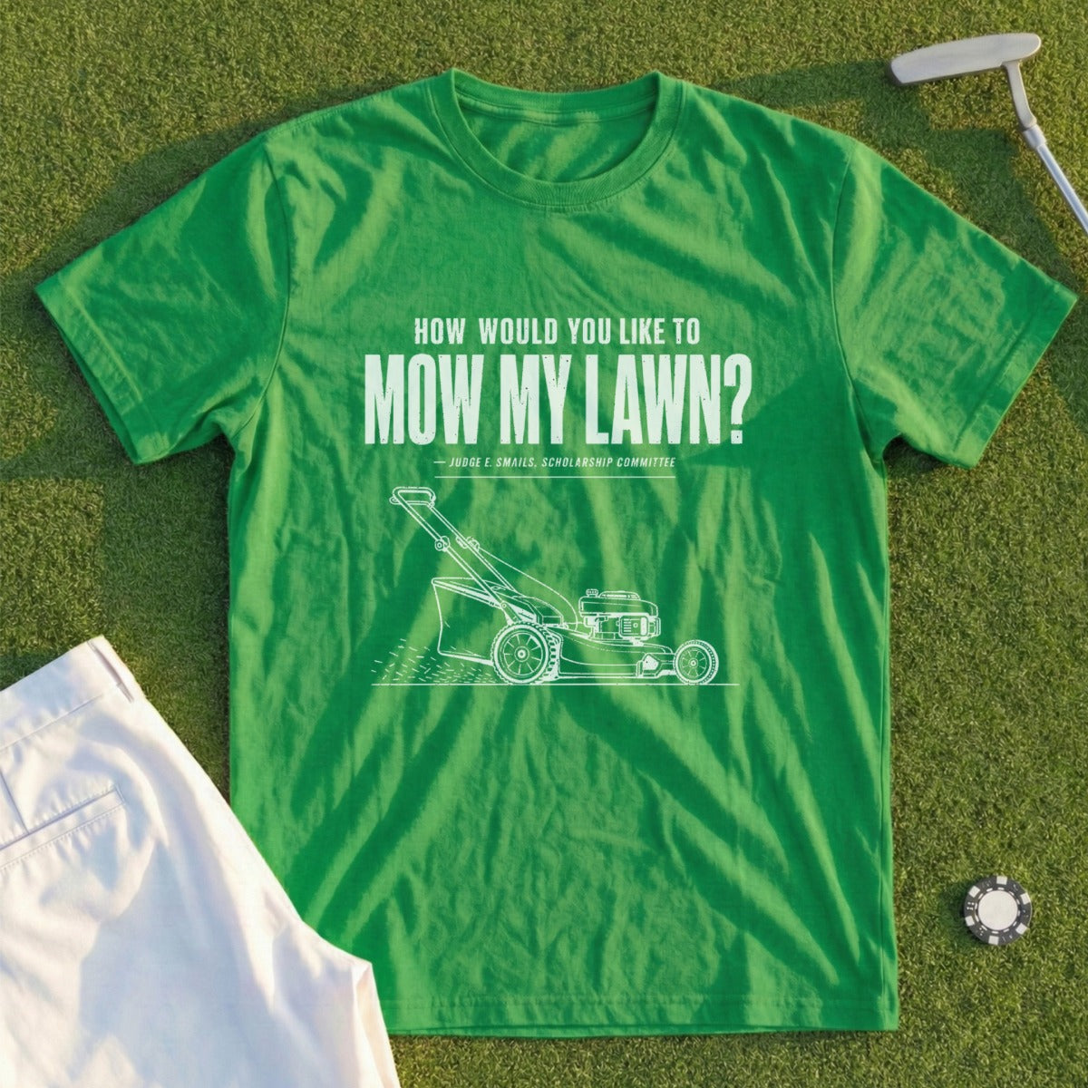Green t-shirt with a lawnmower graphic and quote "Mow My Lawn?"