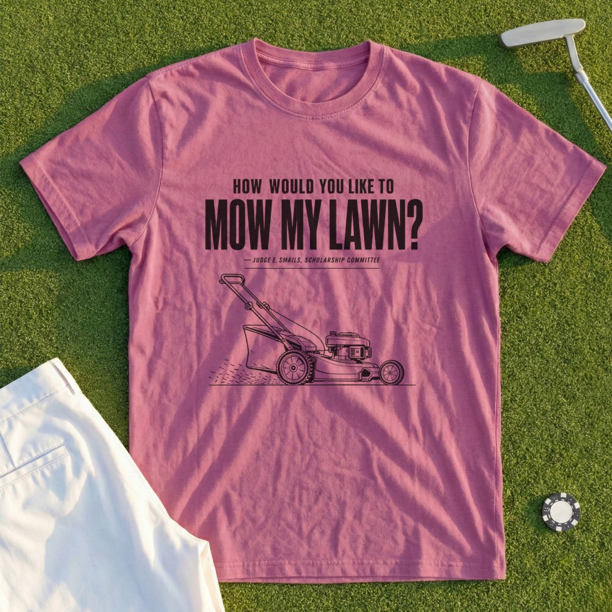 Pink t-shirt with a lawnmower graphic and "How would you like to mow my lawn?" text.
