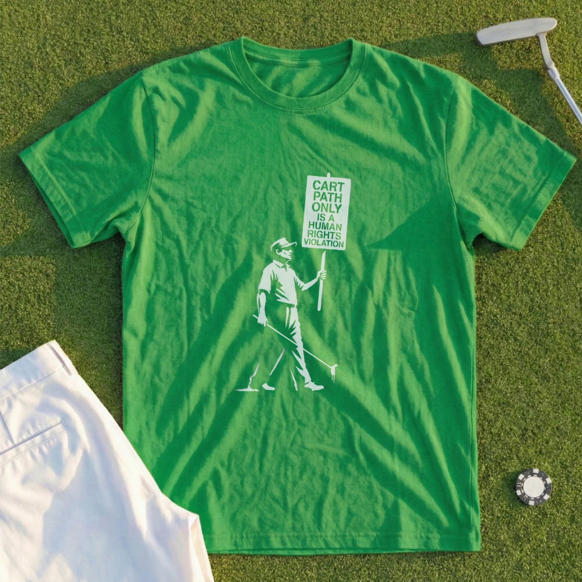 Green t-shirt with graphic of golfer holding "Cart Path Only is Human Violation" sign.