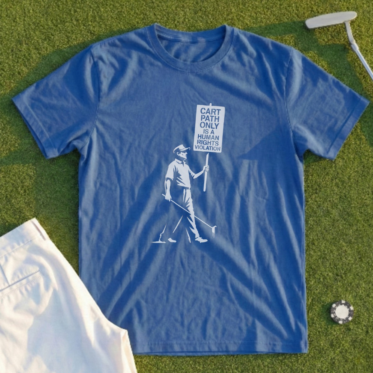 Blue t-shirt with graphic of golfer holding sign "Cart path only is a human rights violation".