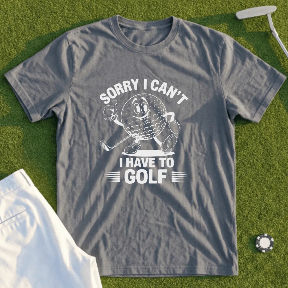 Grey t-shirt with "Sorry I Can't, I Have To Golf" and cartoon golf ball.