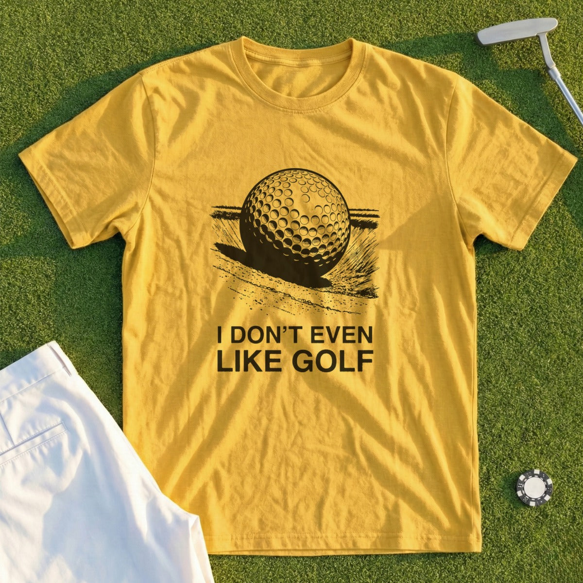 Yellow t-shirt with a golf ball graphic and "I DON'T EVEN LIKE GOLF" text.