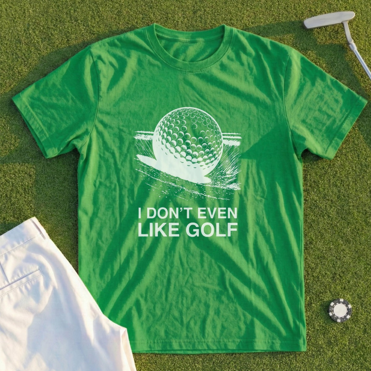 Green t-shirt with a golf ball graphic and "I DON'T EVEN LIKE GOLF" text.