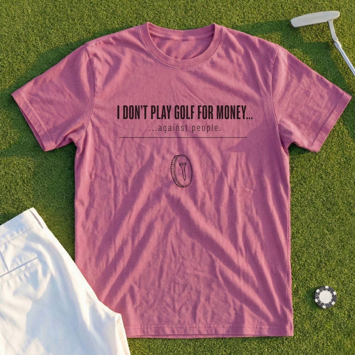 Mauve t-shirt with "I don't play golf for money... against people." text.