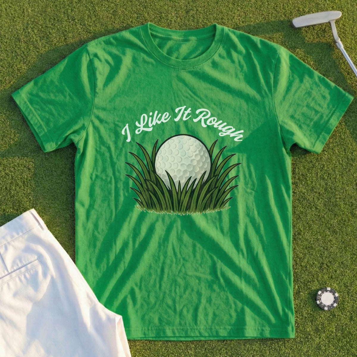 Green t-shirt with "I Like It Rough" text and a golf ball in grass.