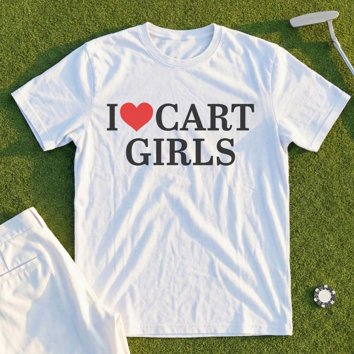 White t-shirt with black text "I ❤️ CART GIRLS" and golf accessories.