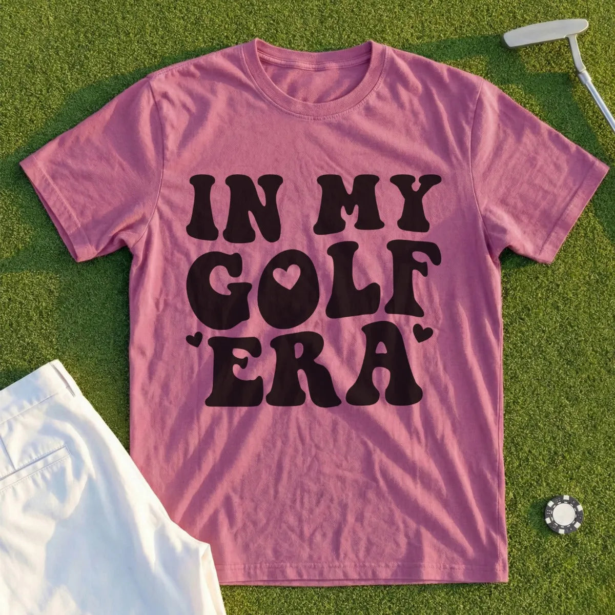 Pink t-shirt with "IN MY GOLF ERA" text and heart details.