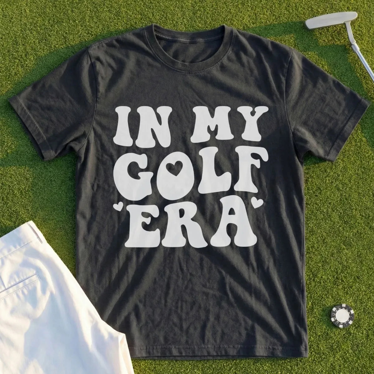 Black t-shirt with "IN MY GOLF ERA" text and heart graphic.