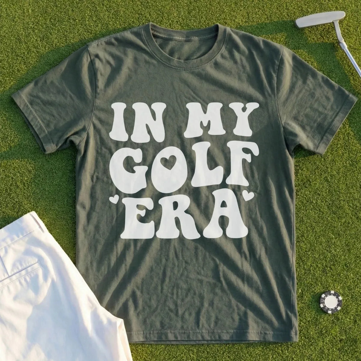 Green t-shirt with white text "IN MY GOLF ERA" and a golf ball graphic.