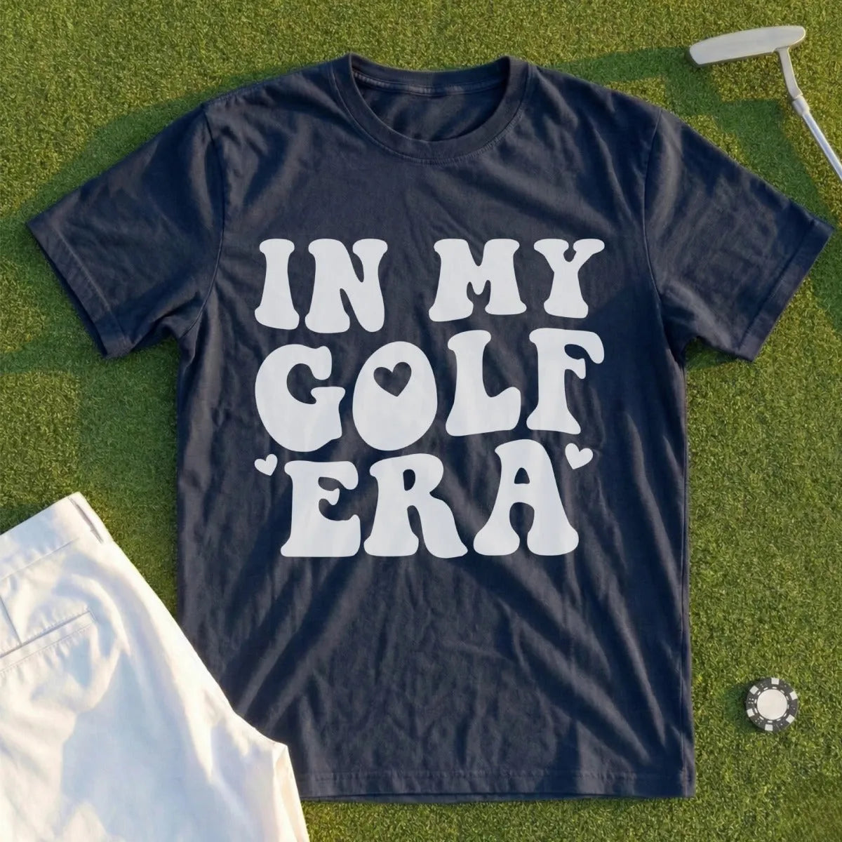 Navy t-shirt with "IN MY GOLF ERA" text and a heart graphic.