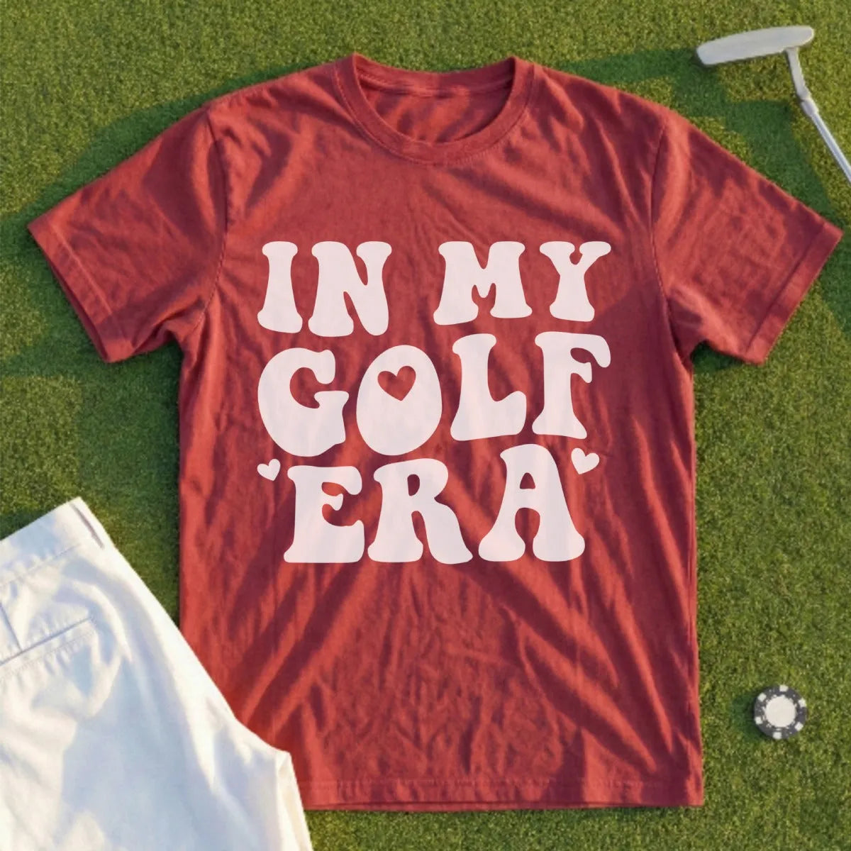 Maroon t-shirt with "In My Golf Era" text and heart graphic.