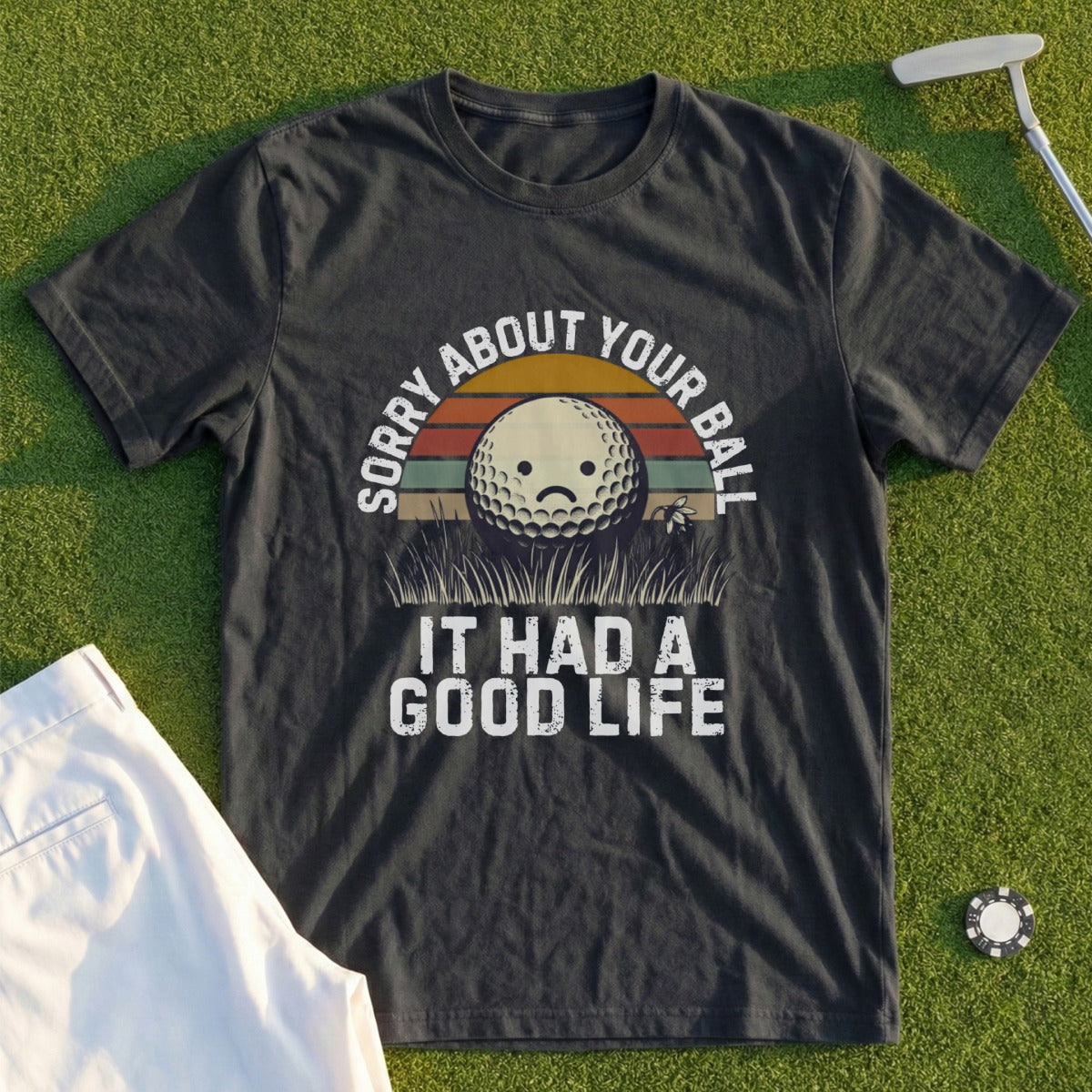 T-shirt with a sad golf ball graphic and text: Sorry About Your Ball It Had A Good Life.