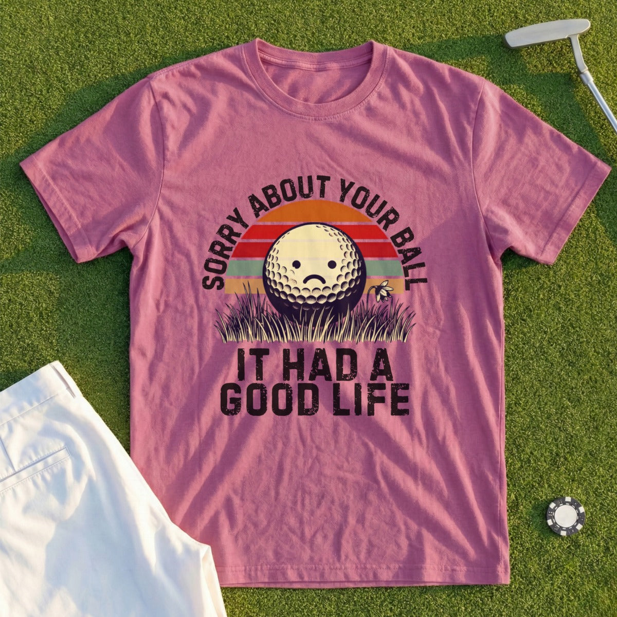 T-shirt with sad golf ball saying "Sorry about your ball it had a good life".