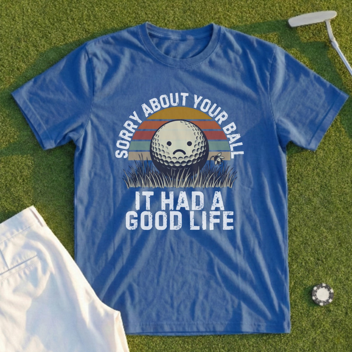 Blue t-shirt with "Sorry About Your Ball It Had a Good Life" graphic.