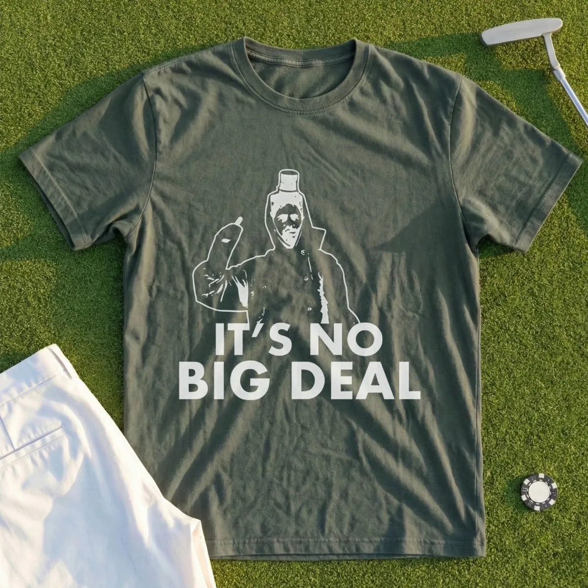 Green t-shirt with white graphic of a figure in a hooded coat and text "IT'S NO BIG DEAL."