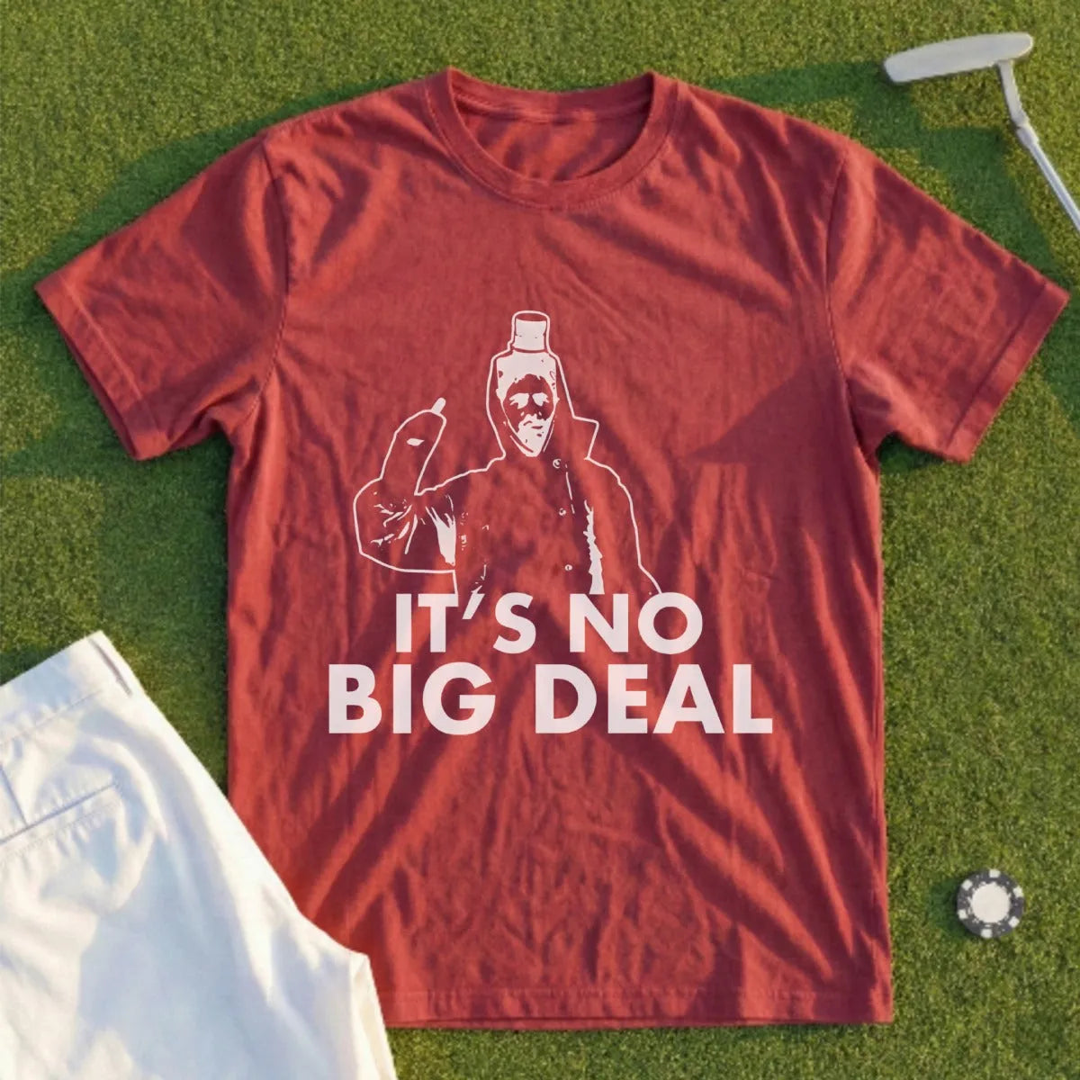 Maroon t-shirt with white graphic of a masked figure and text "IT'S NO BIG DEAL".