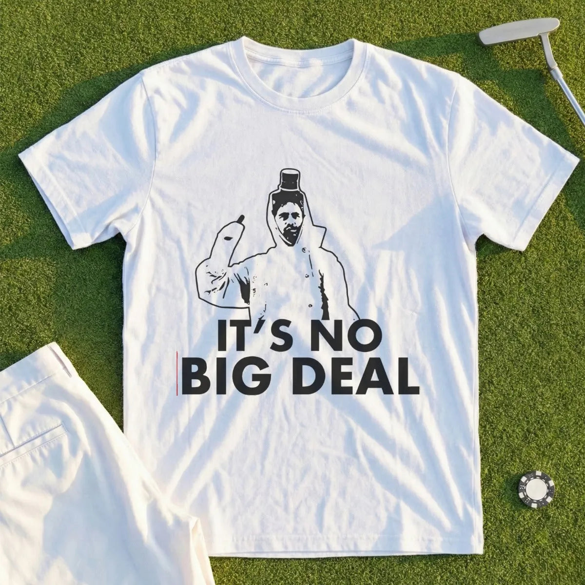 White t-shirt with "IT'S NO BIG DEAL" text and a graphic of a person in a suit.