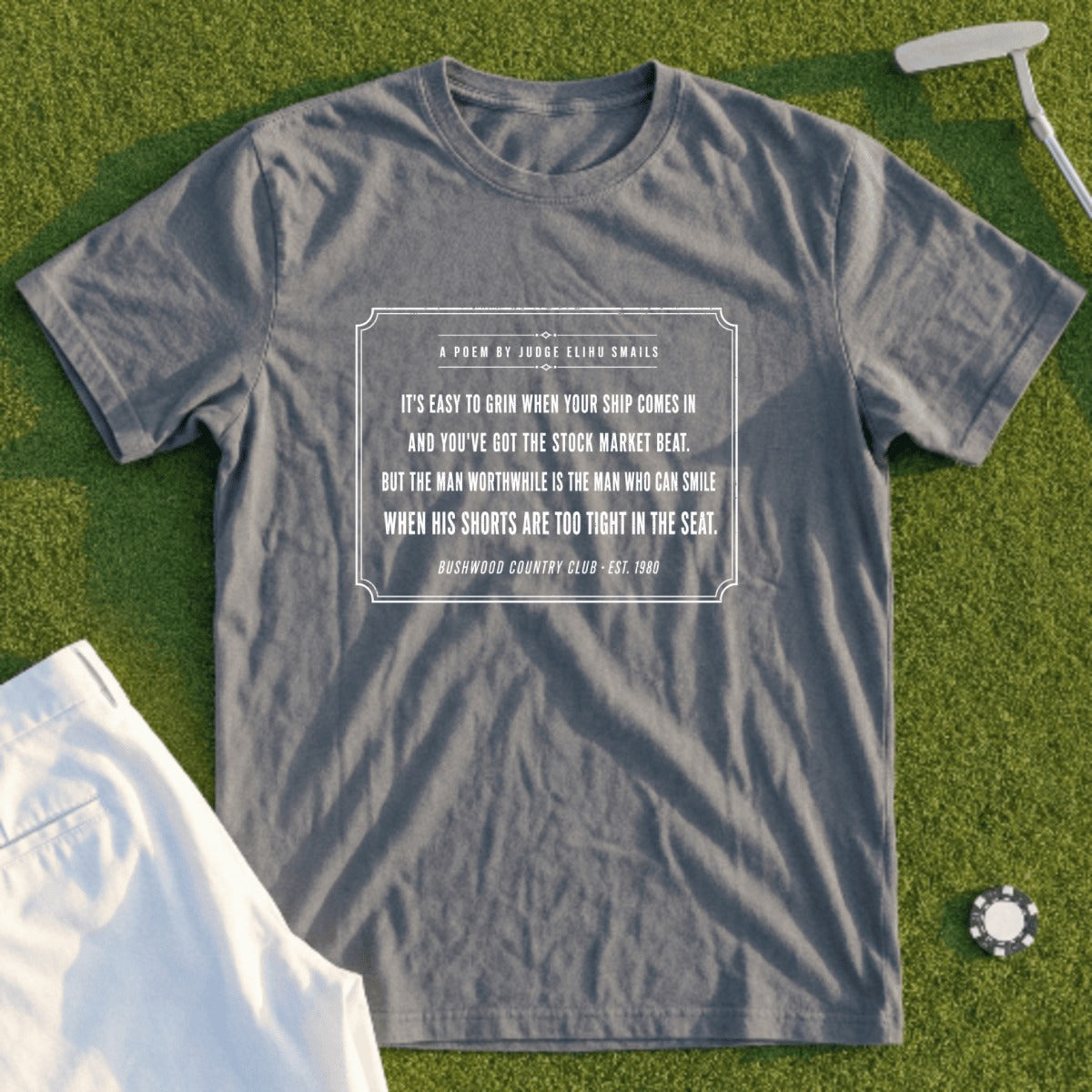 Grey t-shirt with a poem about smiling despite life's discomforts.