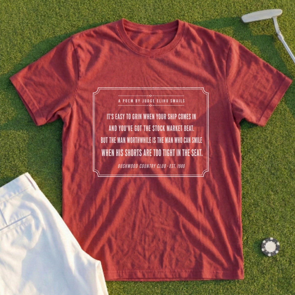 Maroon t-shirt with "Bushwood Country Club" poem and golf accessories.