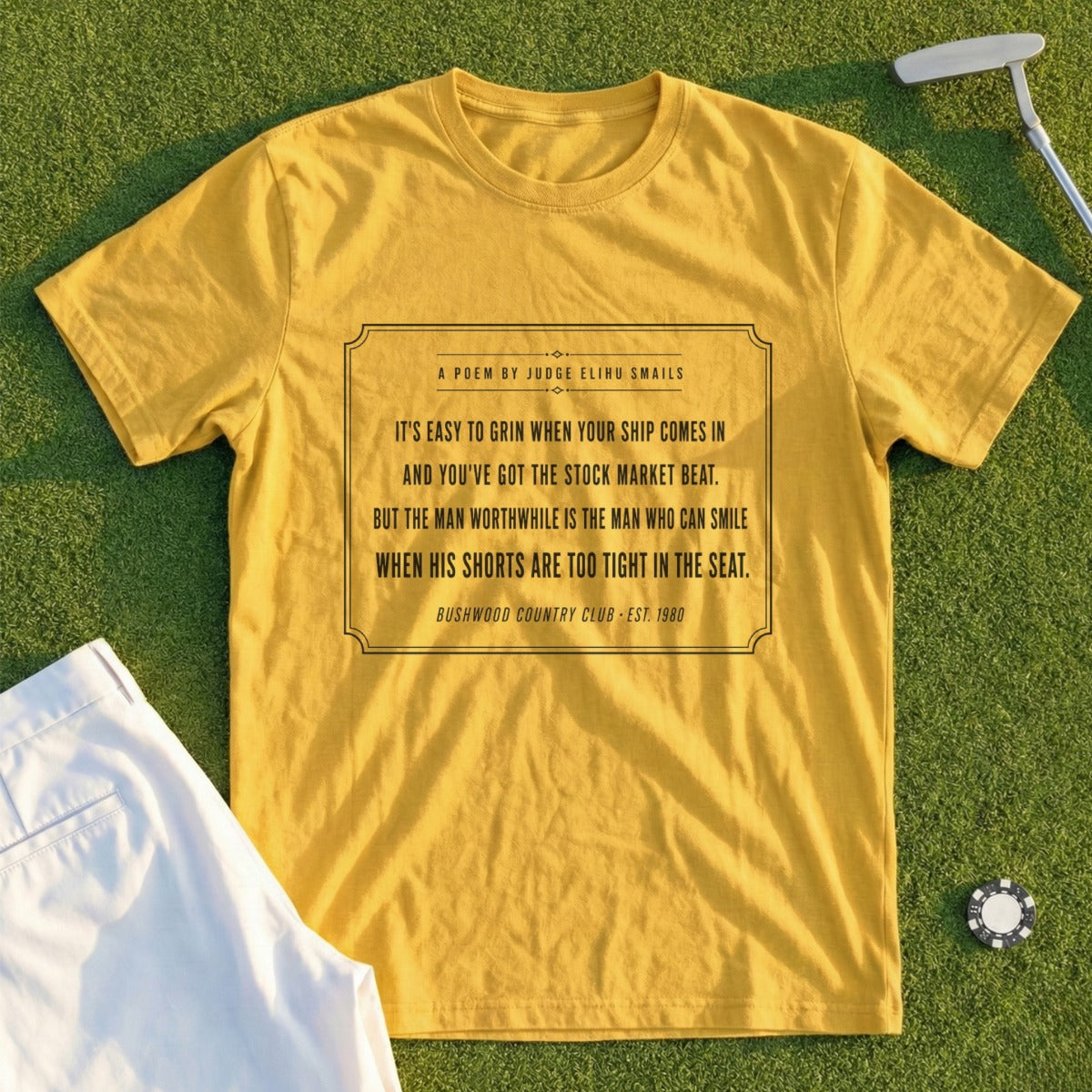 Yellow t-shirt with a quote about grinning and a man smiling.