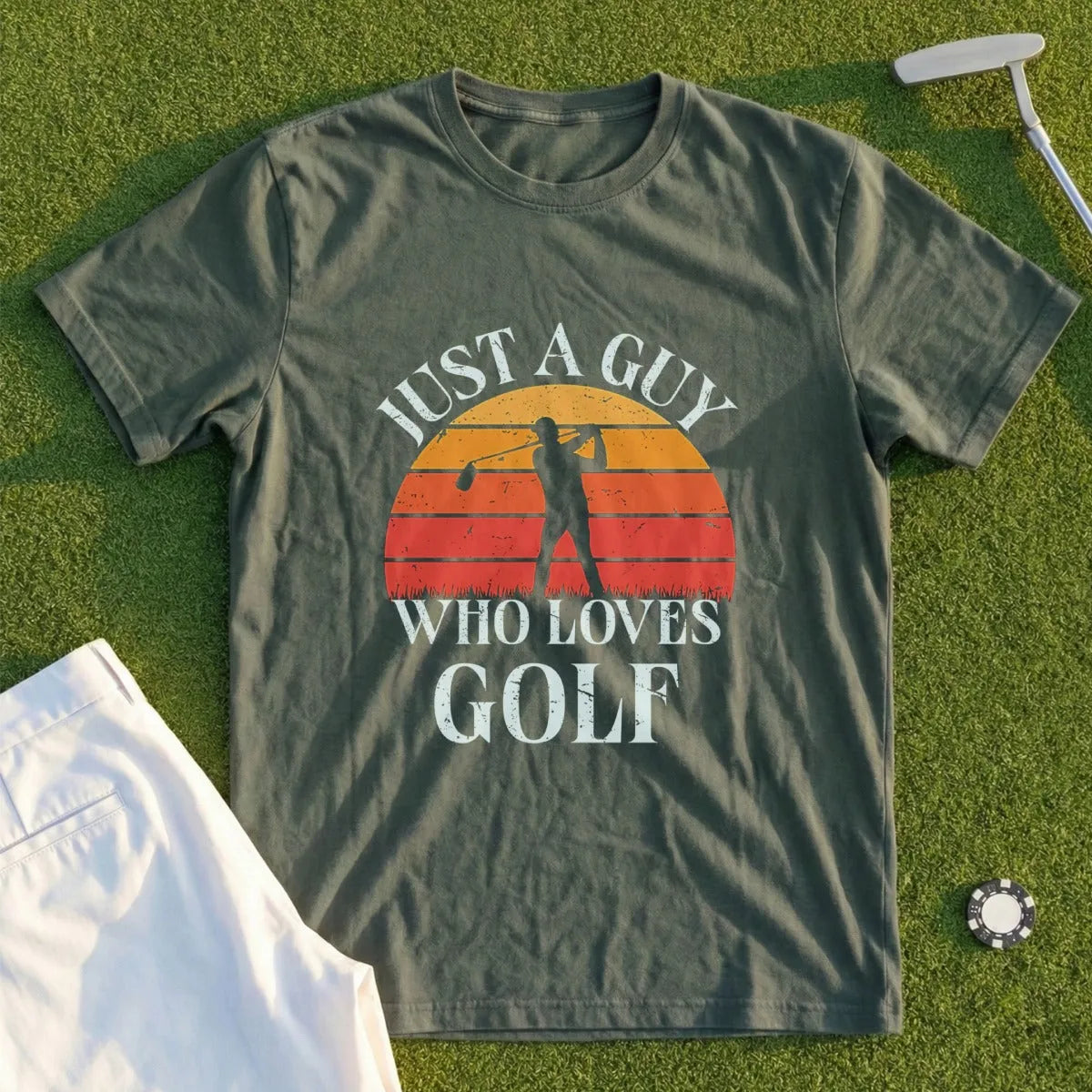 Green t-shirt with "JUST A GUY WHO LOVES GOLF" and a sunset golf graphic.