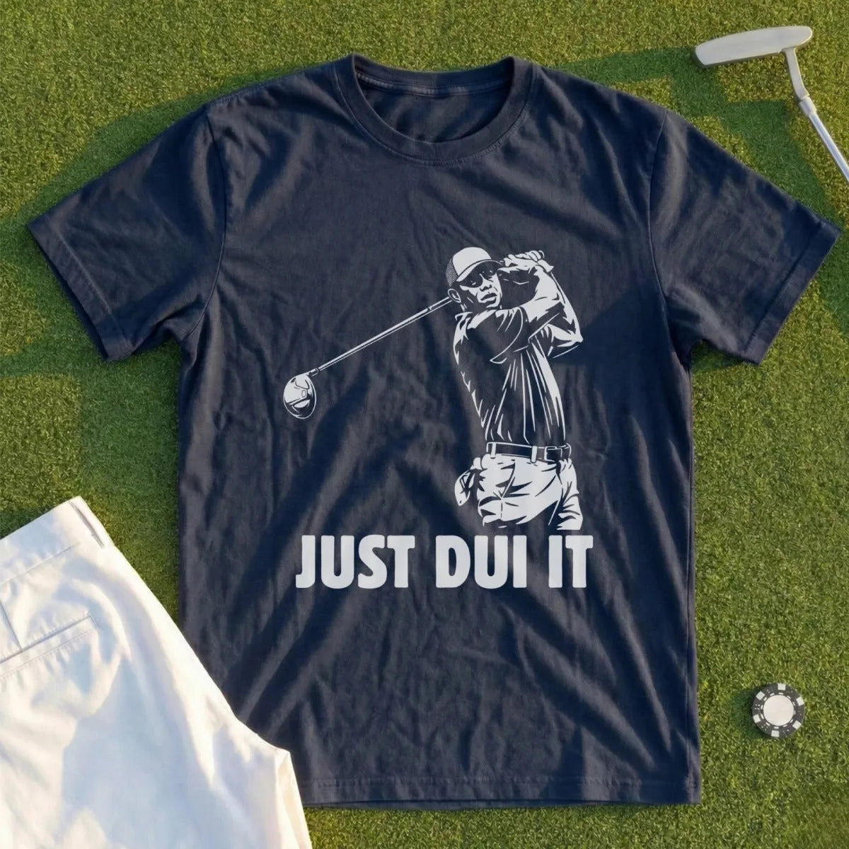 Dark t-shirt with graphic of golfer mid-swing and text "JUST DUI IT".