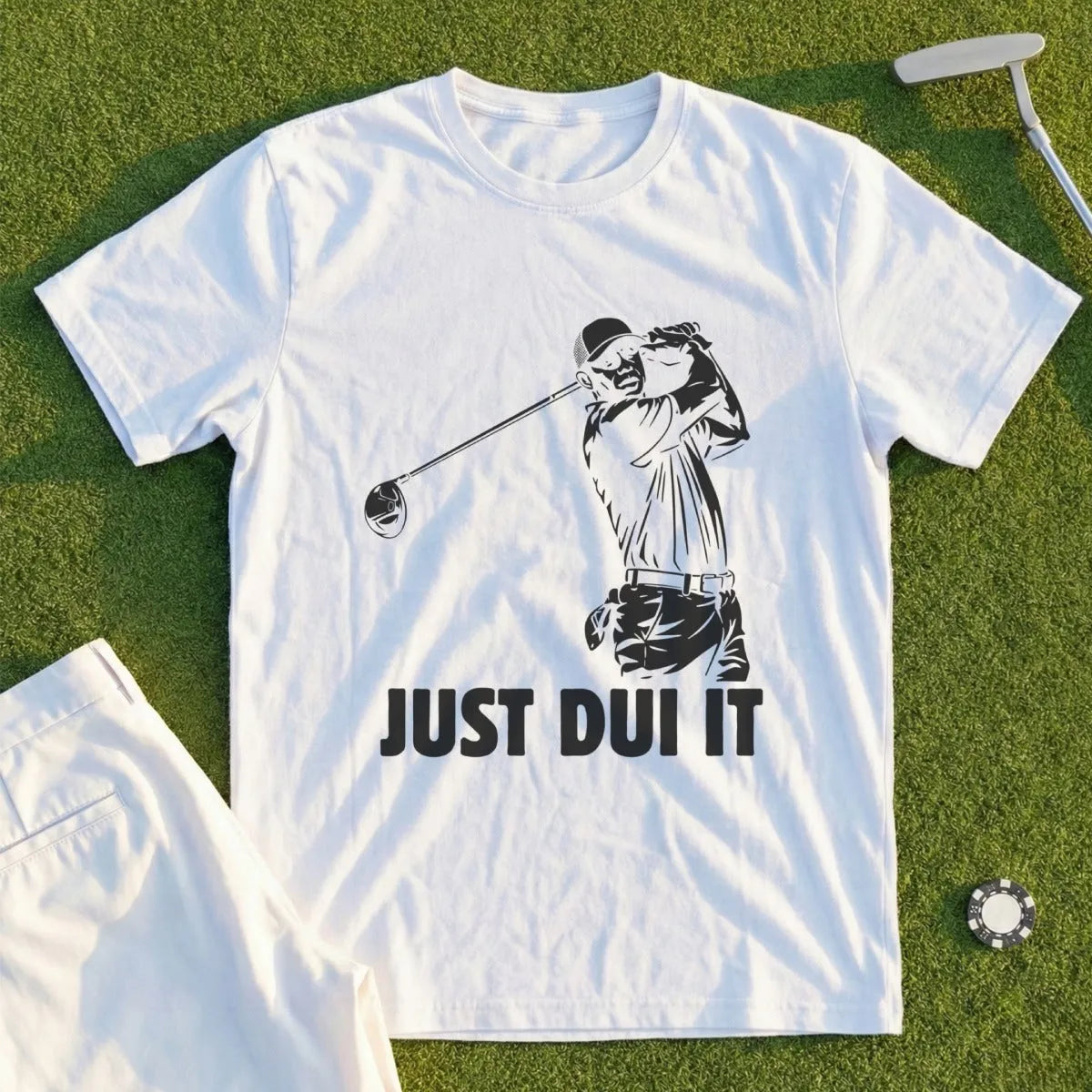 White t-shirt with graphic of golfer and text "JUST DUI IT".