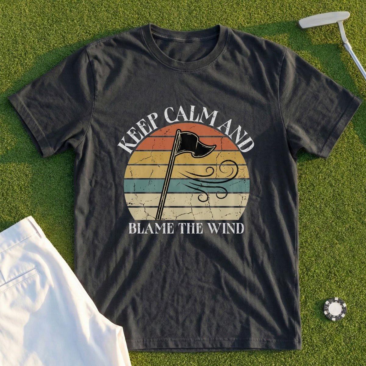 Dark t-shirt with "Keep Calm and Blame the Wind" text and a windblown flag.