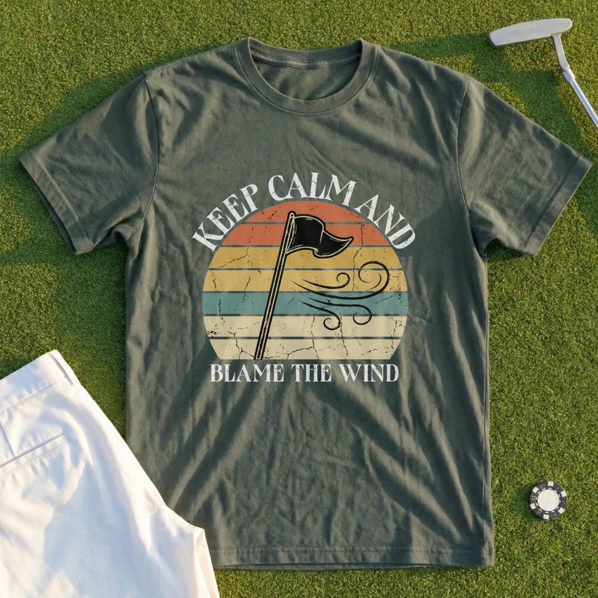 Green t-shirt with "Keep Calm and Blame the Wind" text and a windblown flag design.