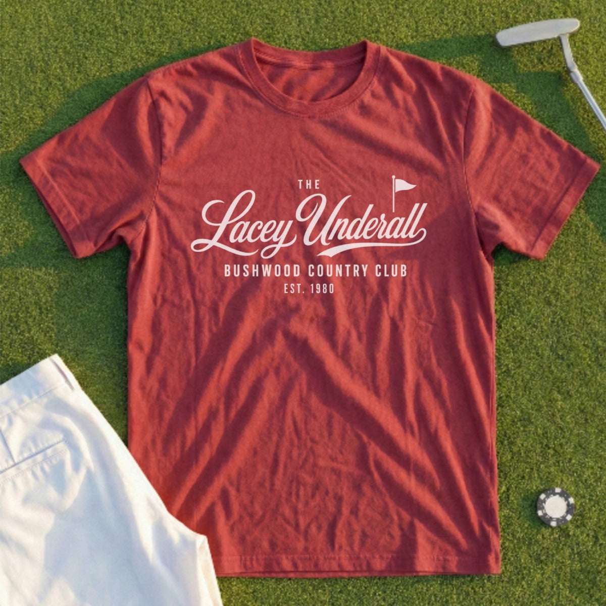 Crimson t-shirt with "The Lacey Underall Bushwood Country Club Est. 1980" logo.