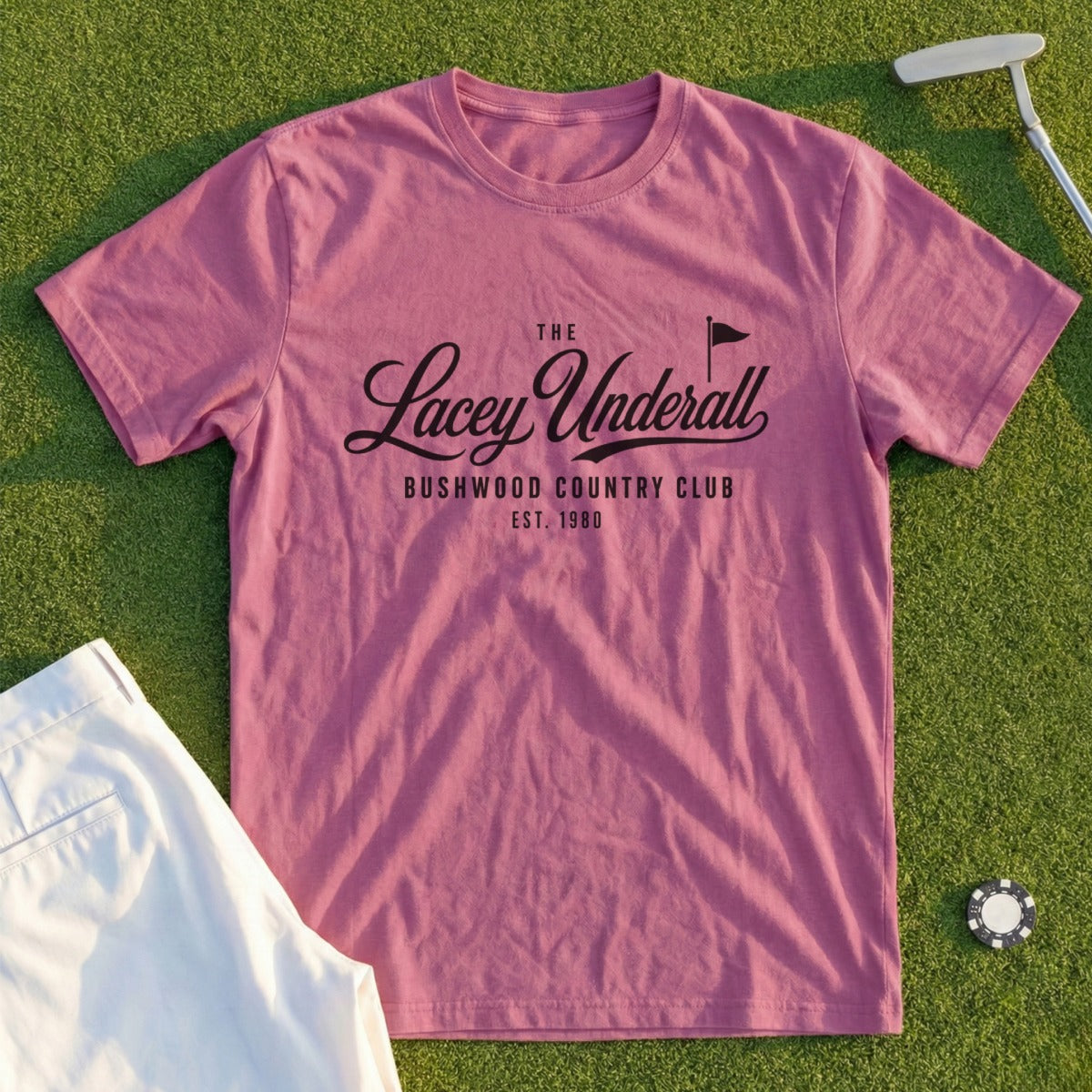 Pink t-shirt with Lacey Underall Bushwood Country Club EST. 1980 logo.