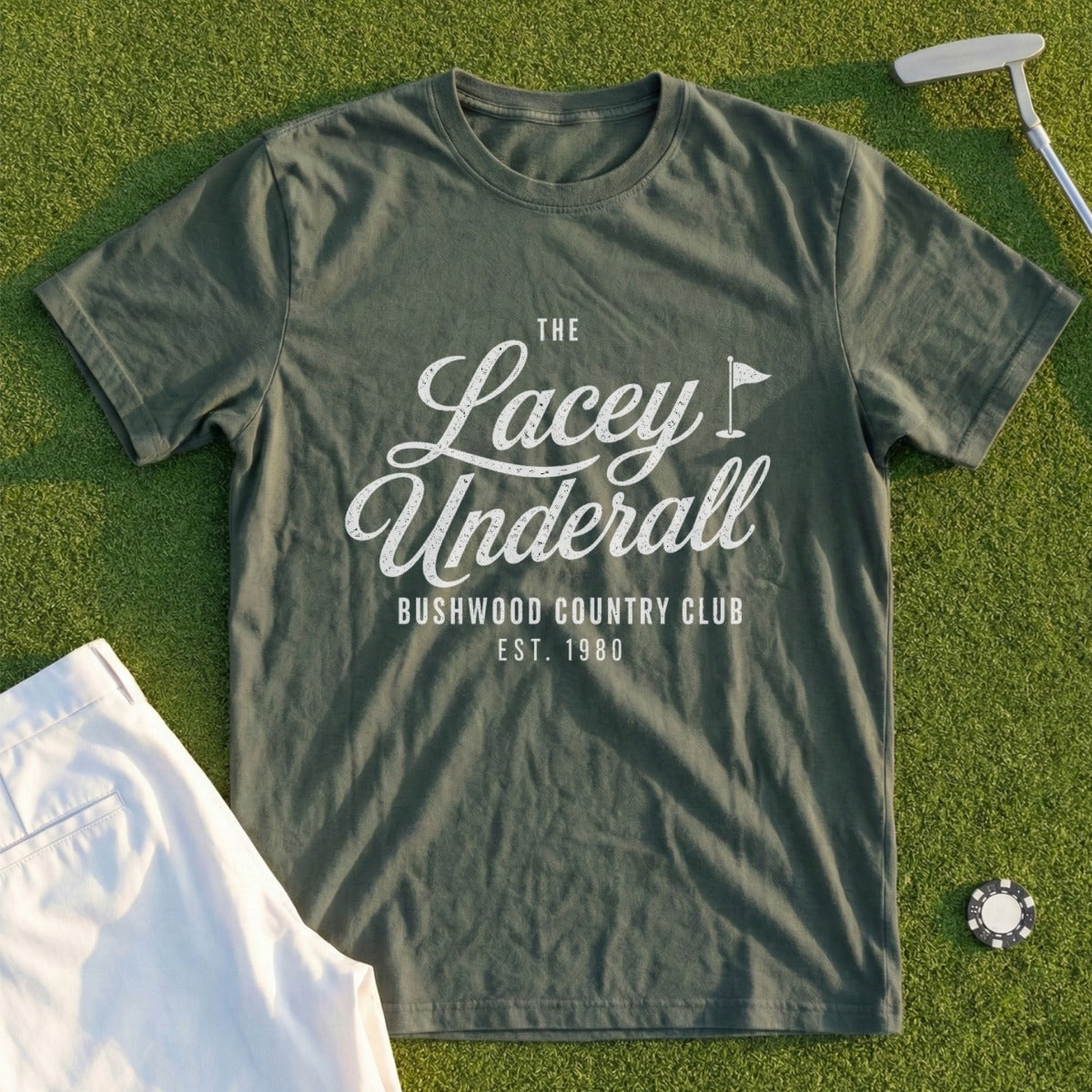 Olive green t-shirt with "Lacey Underall Bushwood Country Club Est. 1980" text.