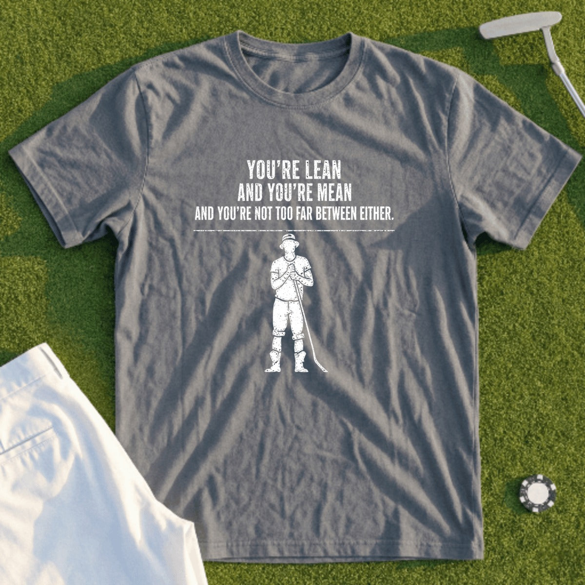 Gray t-shirt with a golfer graphic and text "You're lean and you're mean and you're not too far between."