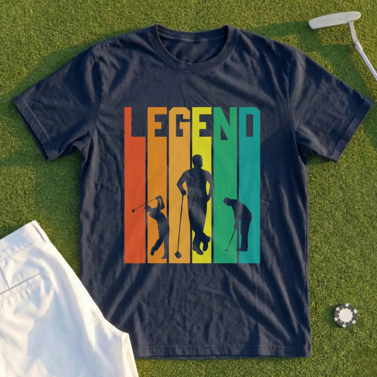 Navy t-shirt with "LEGEND" in colorful stripes and three golfer silhouettes.